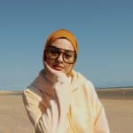 Image shows model with hijab posing for Millennial Muslim agency Modest Visions campaign with ASOS and Levi's