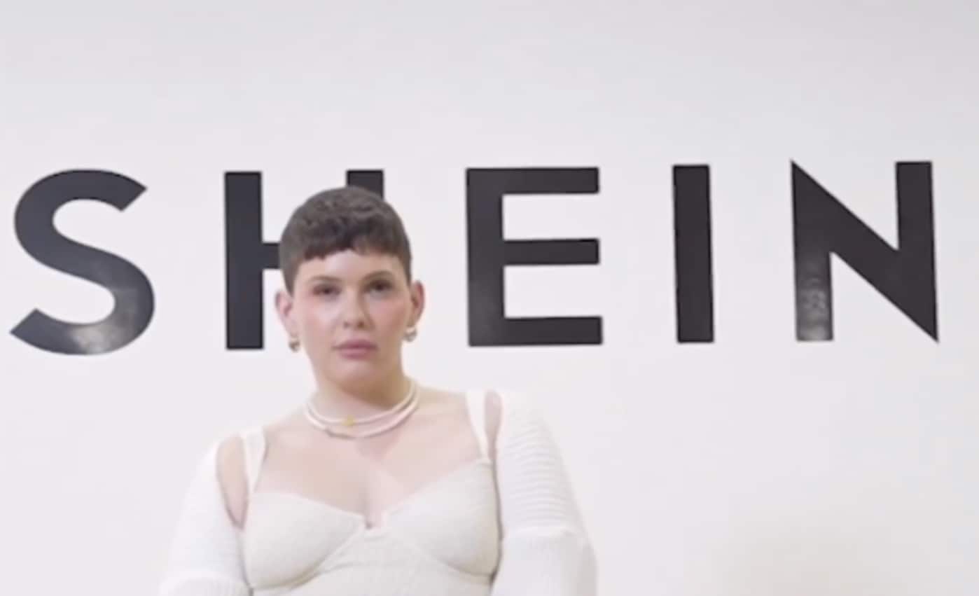 US creator Dani DMC in front of Shein sign on controversial press trip